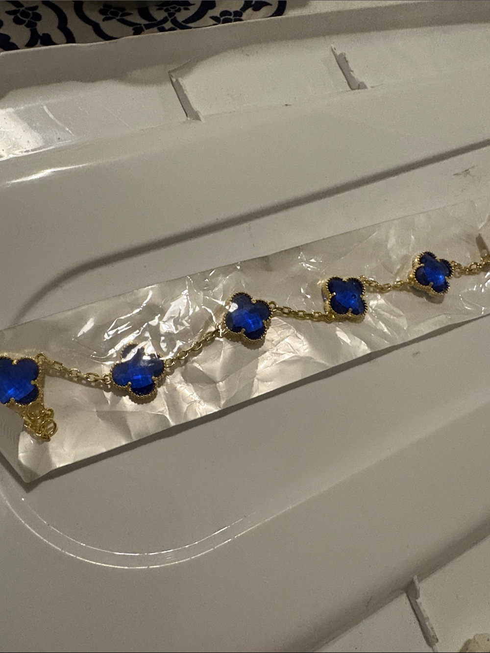 Gold Bracelet with Deep Blue Clover Gemstones